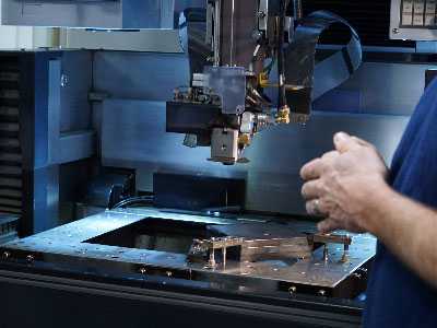 man works on a machine